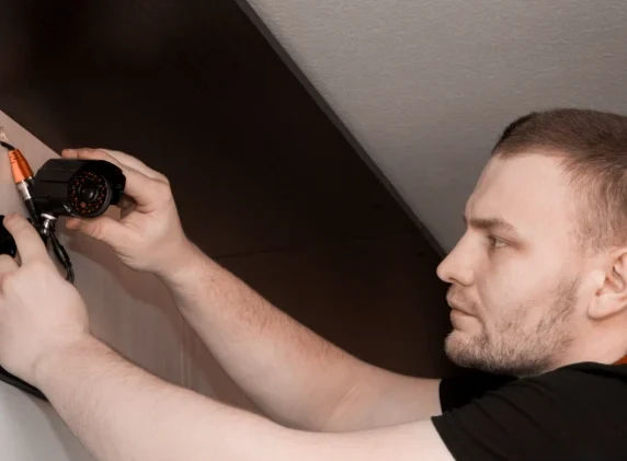 OC Fire & Security engineer fitting a CCTV camera
